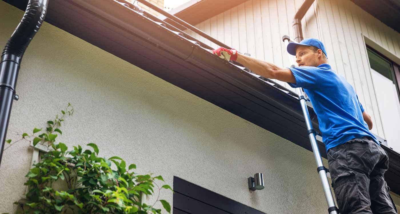 Refresh Exteriors showcasing the process of installing a new gutter system on a residential home to protect property from damage.