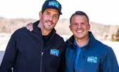 Two men from the Refresh Exteriors team are smiling warmly. The image invites the viewer to learn more about Refresh Exteriors and how they stand out in the industry.