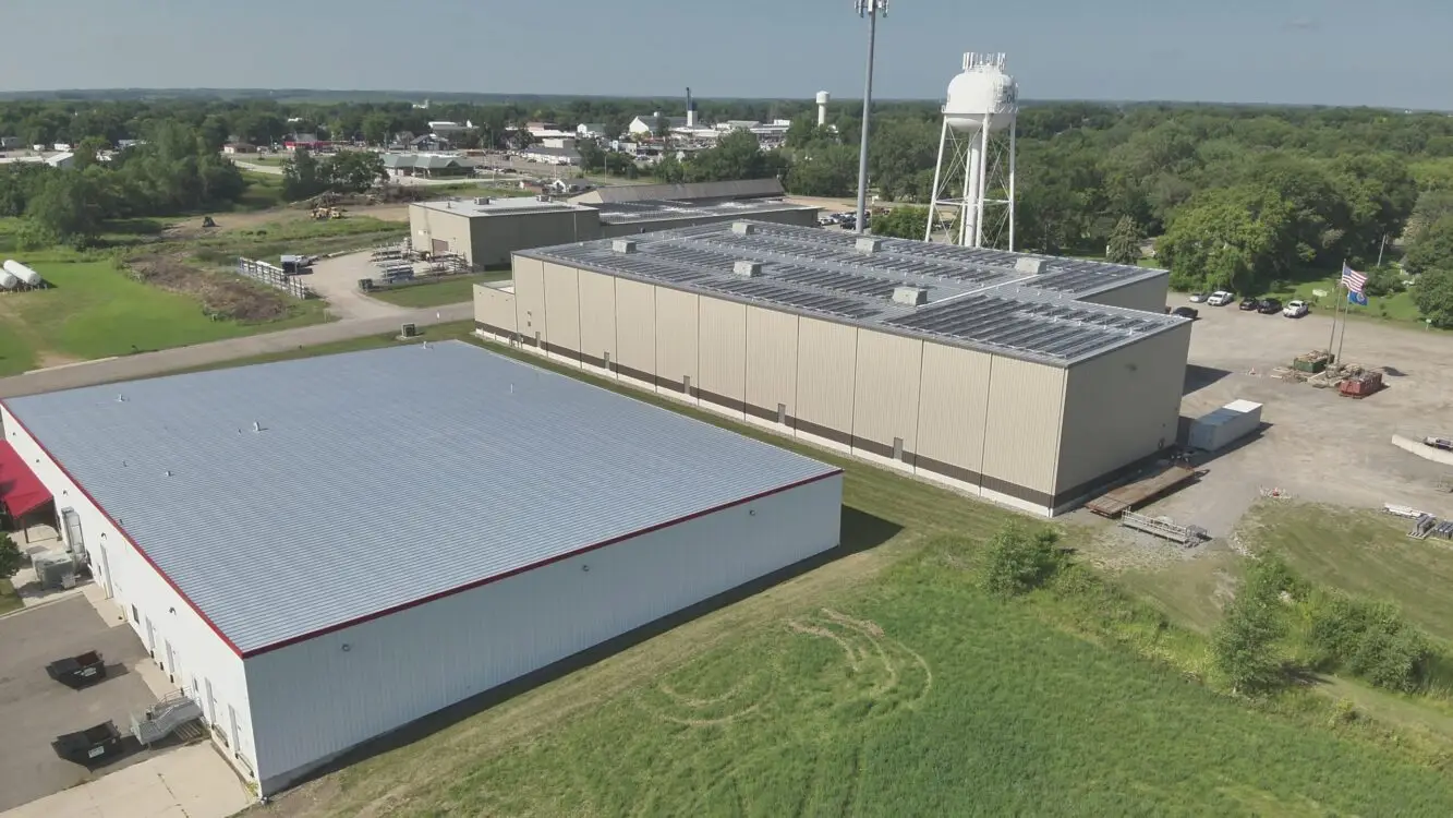 A view of a metal and solar roofs build by Refresh Exteriors LLC Minnesota’s Most Referred Roofing Contractor. Commercial Roofing Solutions Eden Prairie